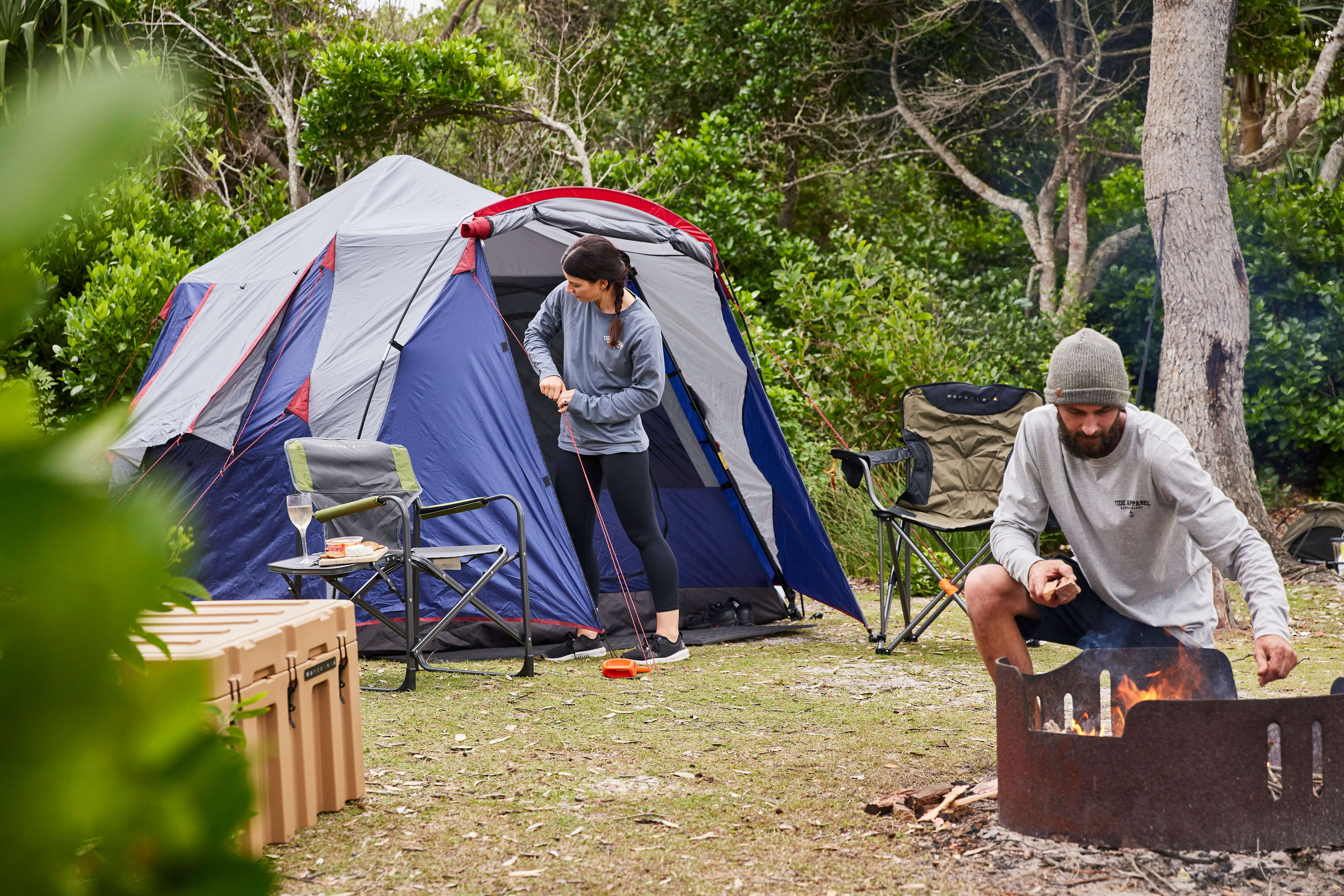 Two campers setting up